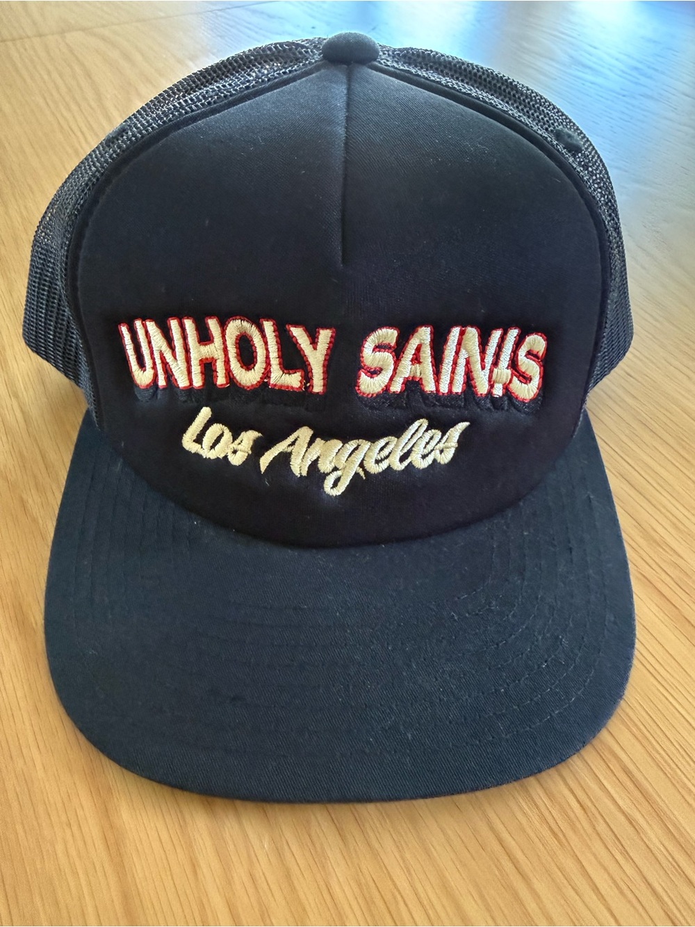 Unholy Saints Los Angeles Embroidered Vintage Black Trucker Hat